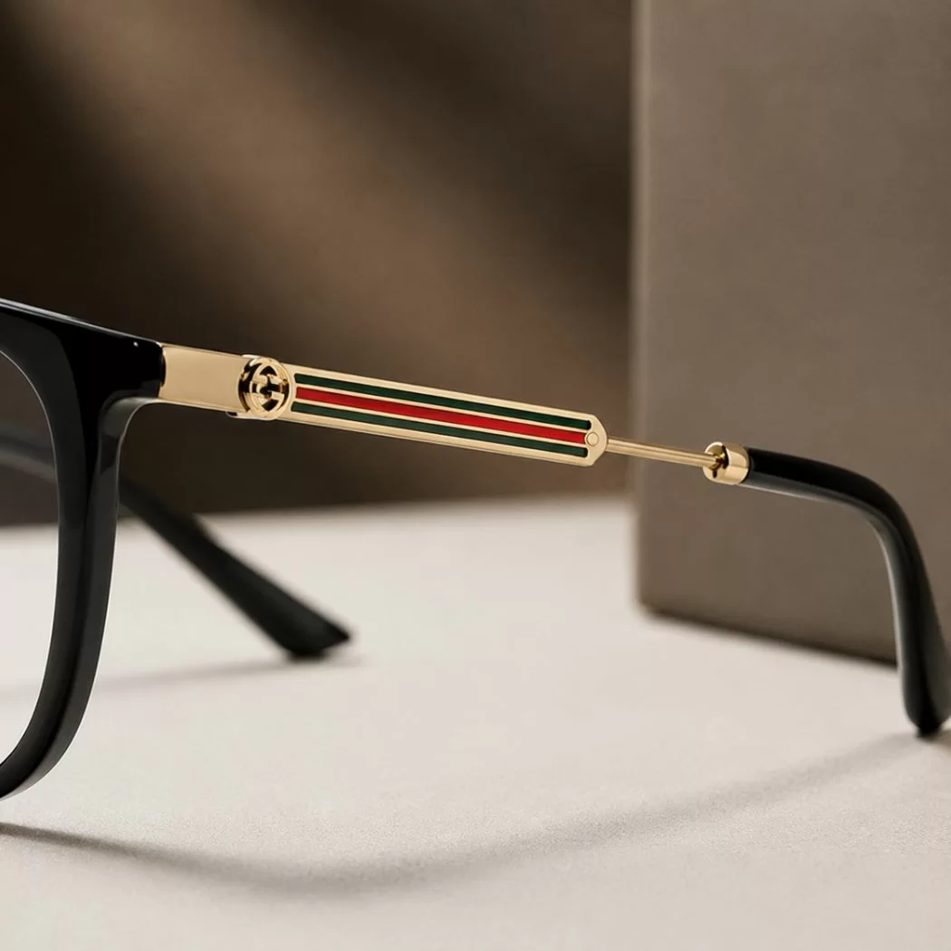Sọc Web kim loại trên càng kính Gucci